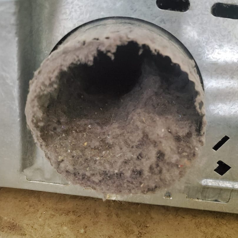 Interior of a dryer duct heavily coated with lint