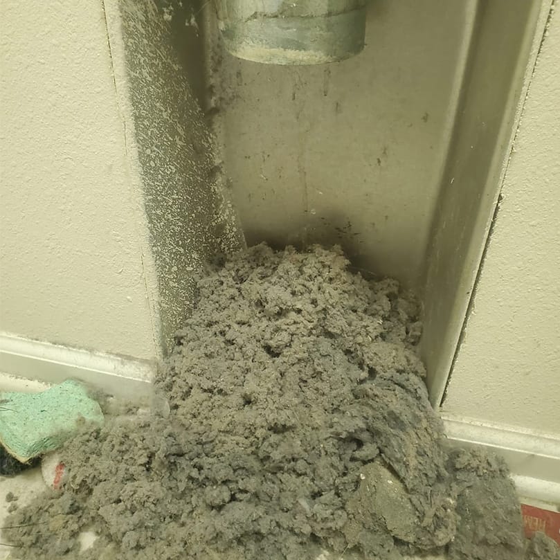 Accumulated debris at an opened duct connection