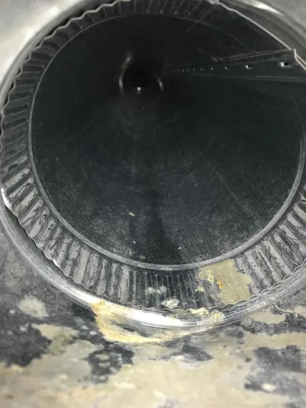 Inside of a round duct after cleaning, with the duct floor clear