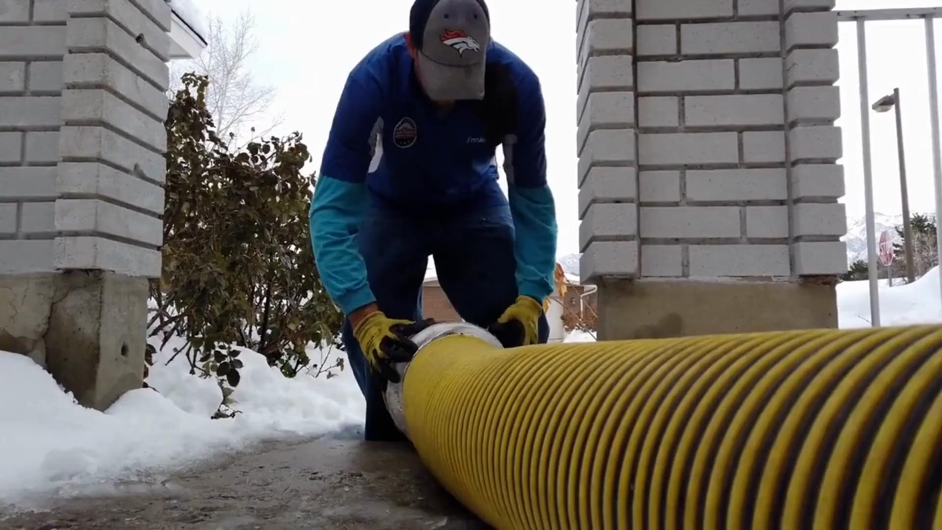 Fresh Ducts technician connecting professional negative-air duct cleaning equipment at a Utah home
