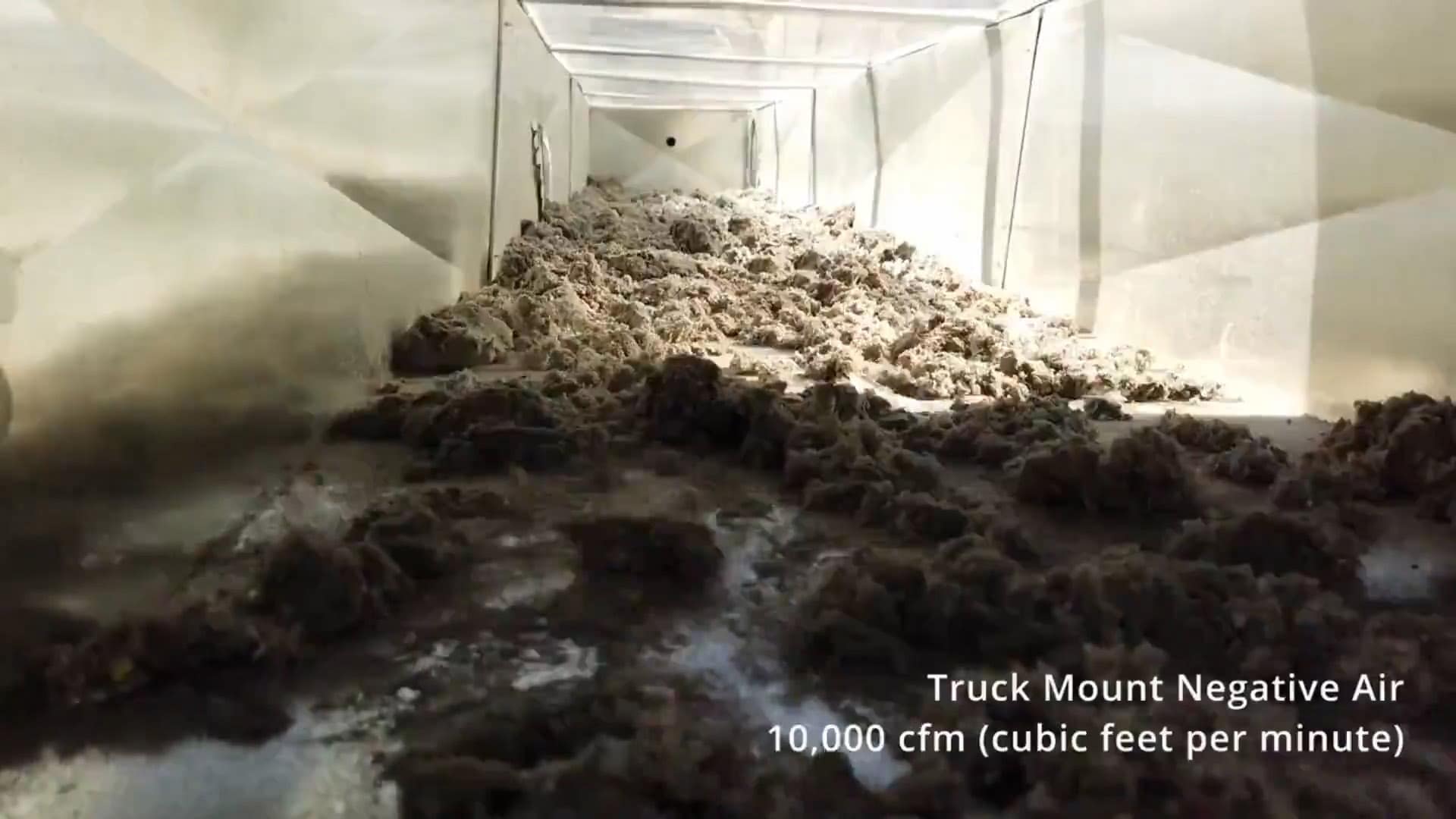 Dust and debris documented inside residential ductwork before cleaning